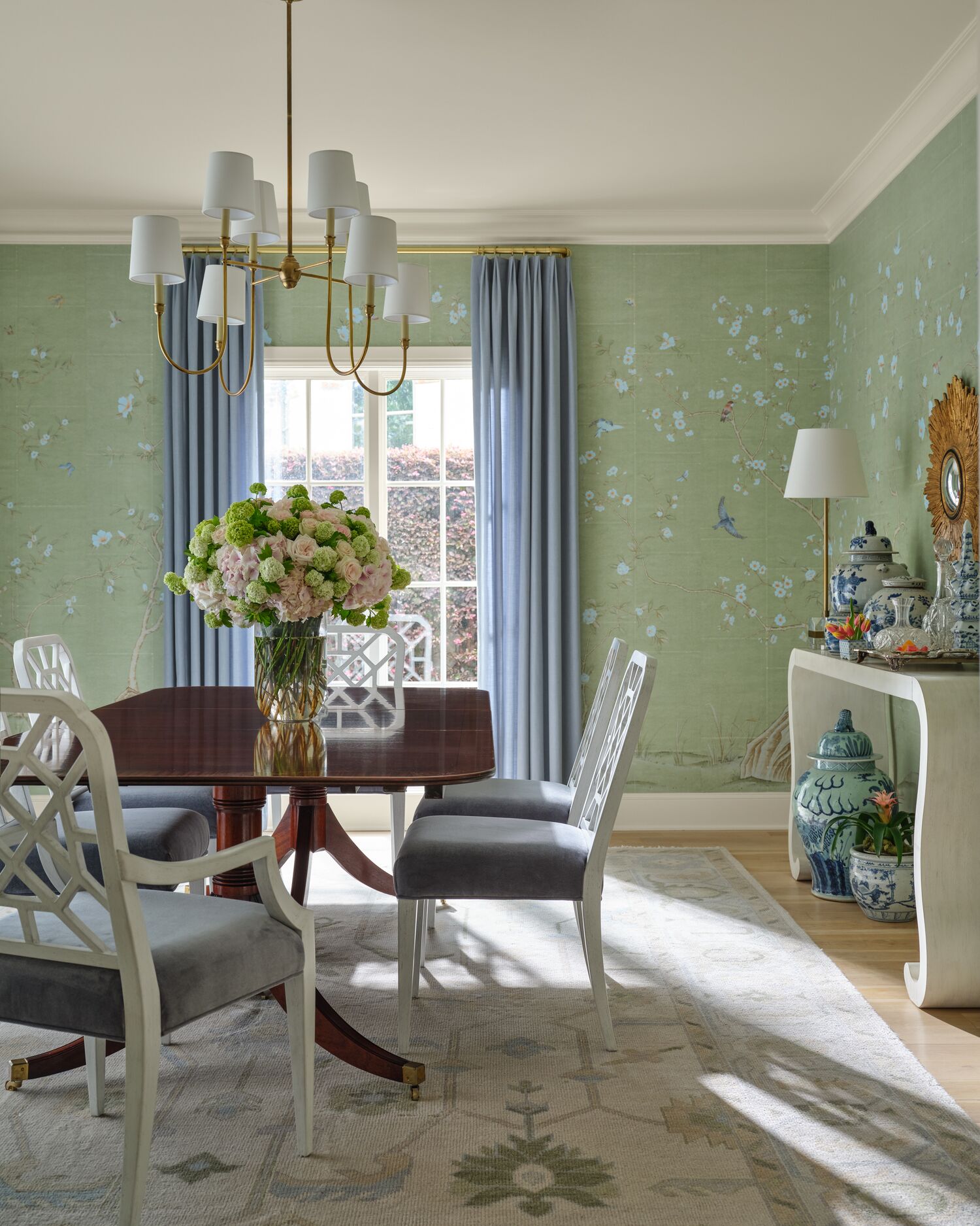 Formal dining room with green chinoiserie wallpaper and brass chandelier, Edmondson Two Home in Highland Park, TX